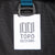 Topo Designs logo patch on Global Travel Bag Roller durable carry-on convertible laptop backpack rolling suitcase in Navy blue.