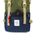 Front Detail Shot of the Topo Designs Rover Pack Classic in Olive/Navy showing front zipper pocket.