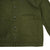 Detail shot of Topo Designs Women's Dirt Jacket in Olive green showing front pockets and buttons.