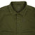 Detail shot of Topo Designs Women's Dirt Jacket in Olive green showing collar, inside tag, chest logo, and buttons.