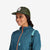 Topo Designs Trucker Hat with mesh back and original logo patch in olive green on model.