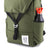 Front detail shot of Topo Designs Y-Pack in olive green showing water bottle pocket